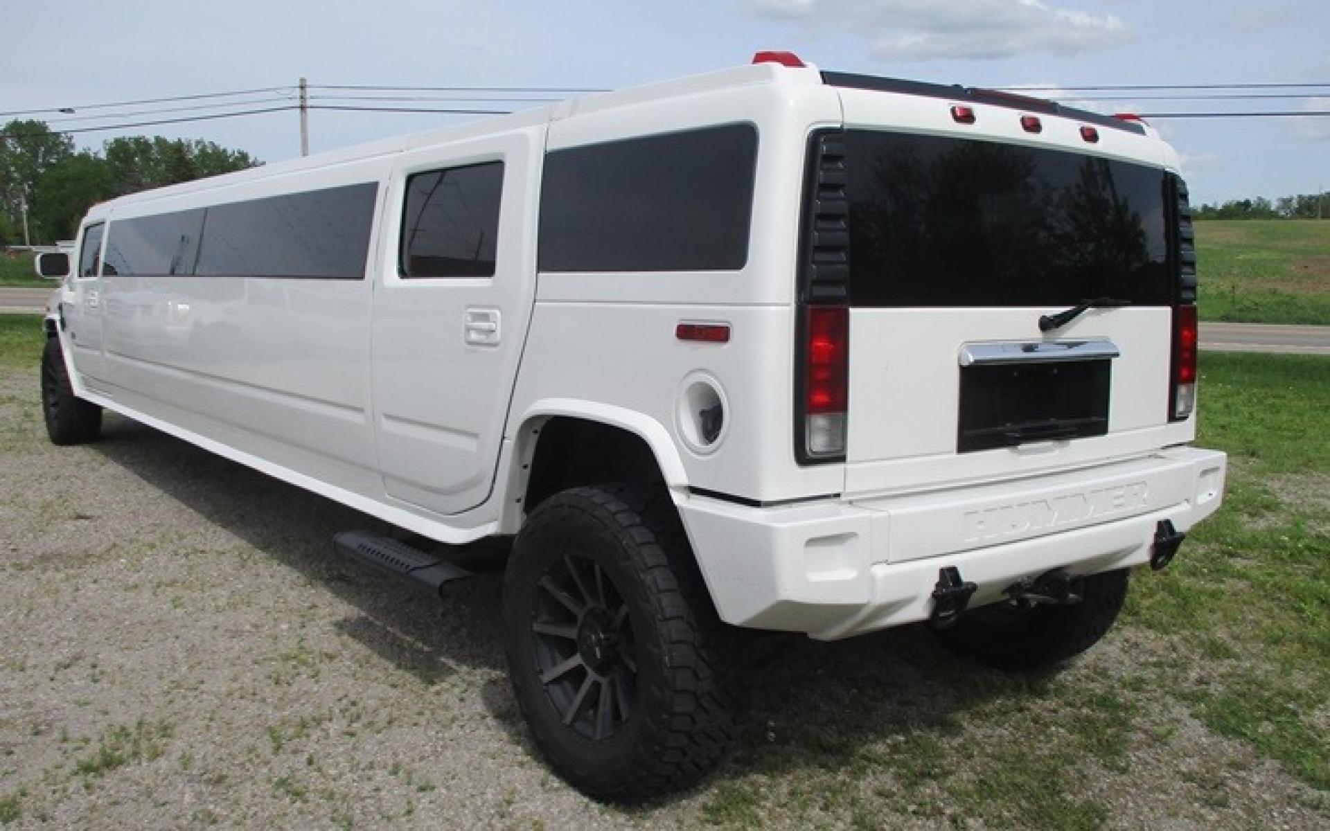 2005 White /White/Black Hummer H2 , located at 1725 US-68 N, Bellefontaine, OH, 43311, (937) 592-5466, 40.387783, -83.752388 - 2005 Hummer H2 175" SUV VIP Limousine, White w/White/black leather interior, Front/Rear Ait, Flat Screens, AM/FM/CD reconditioned Interior, LOADED - Photo #3